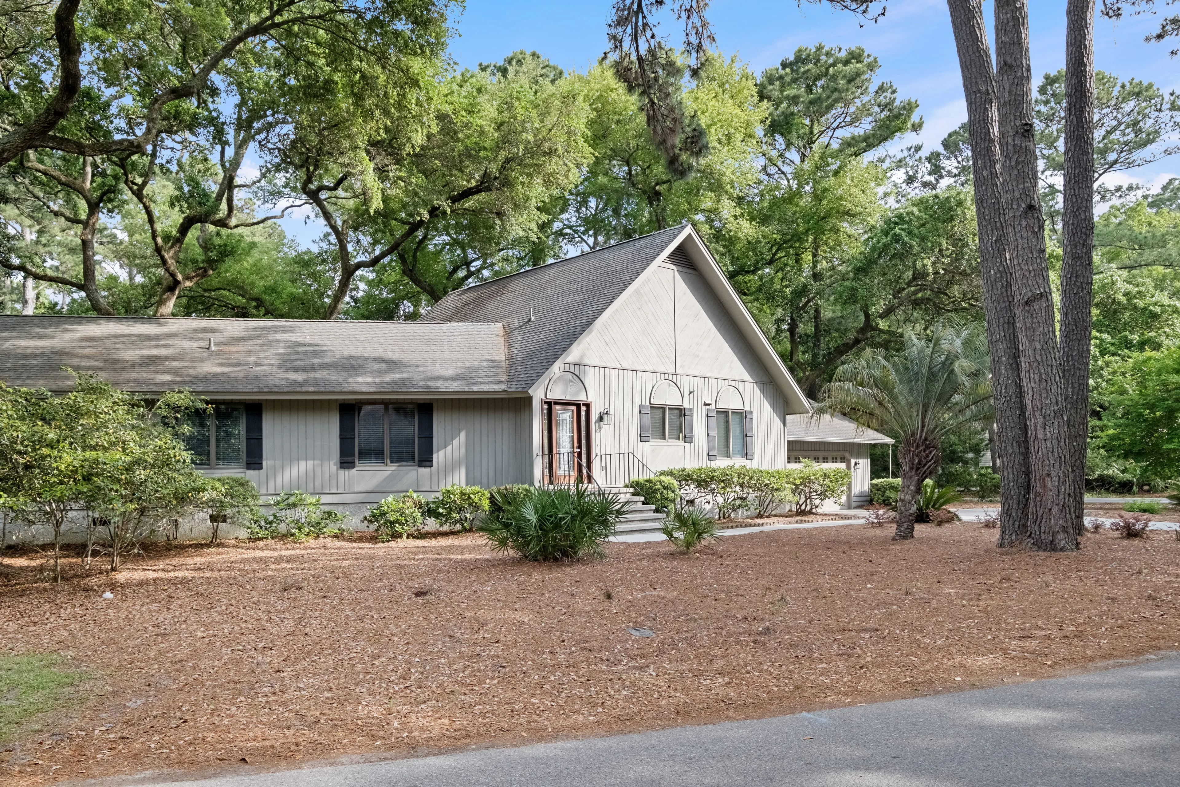 Front exterior of the single-family Sea Pines home