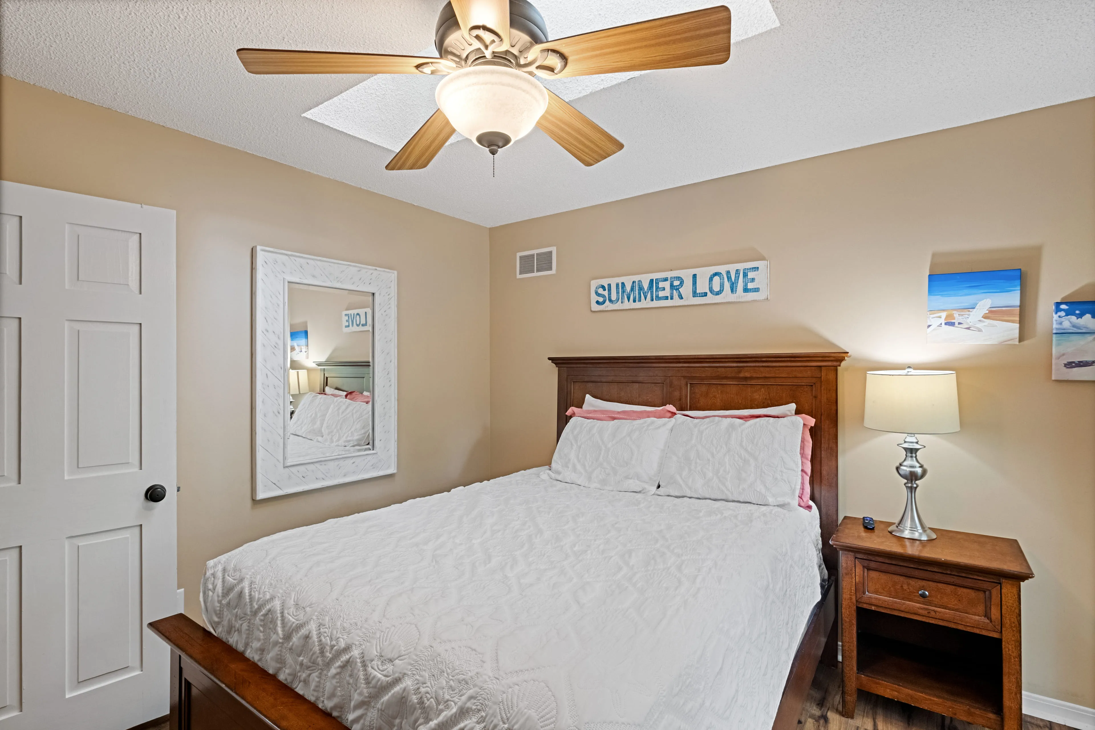 'Summer Love' bedroom with a queen bed and coastal accents