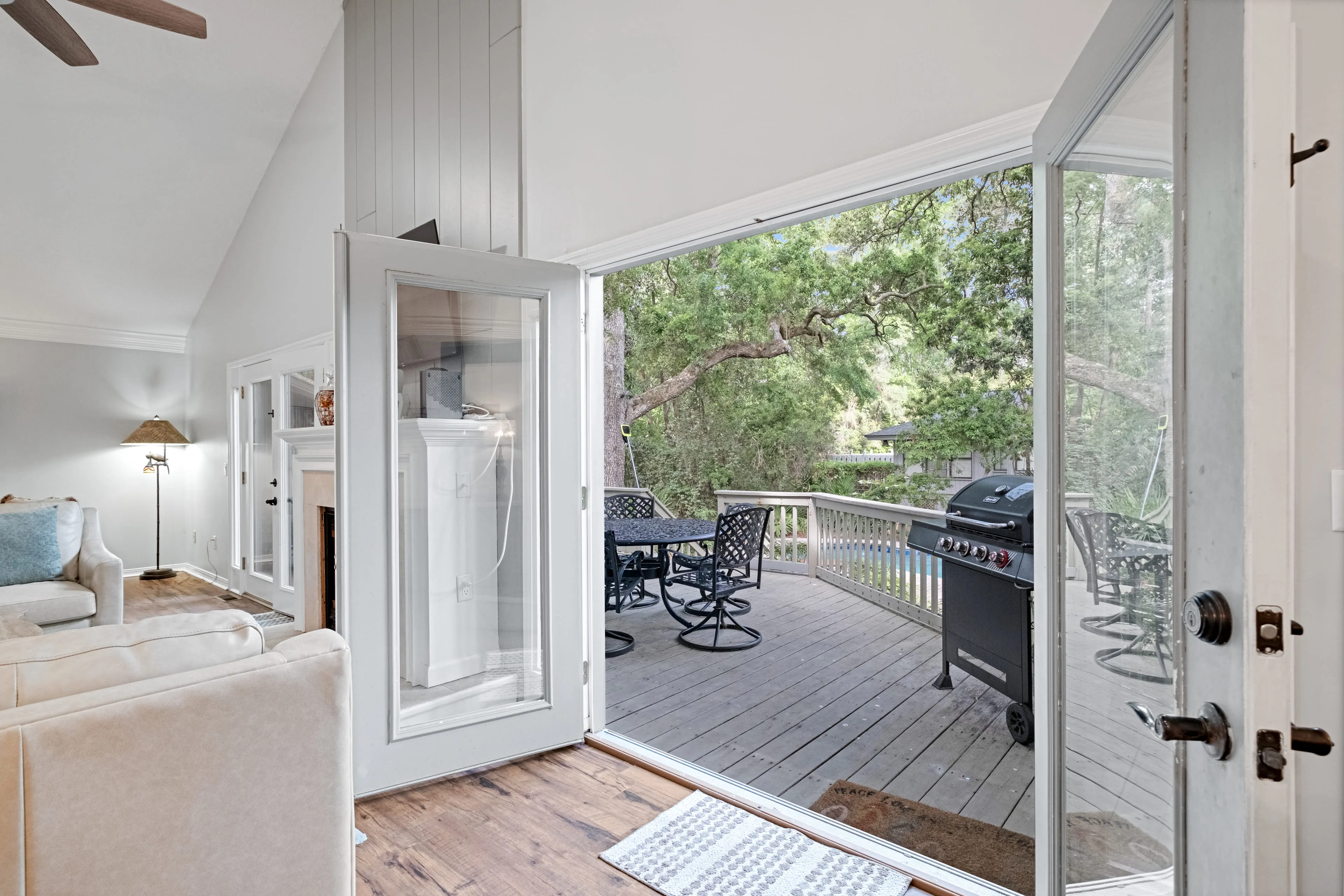French doors from the vaulted living room opening to the deck